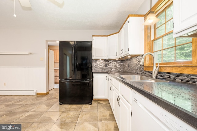 kitchen featuring dishwasher, white cabinetry, black fridge, and a baseboard heating unit