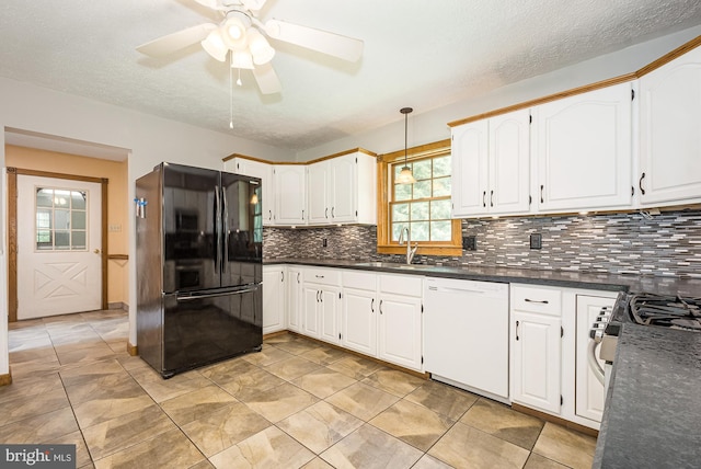 kitchen featuring white cabinetry, dishwasher, ceiling fan, sink, and black fridge