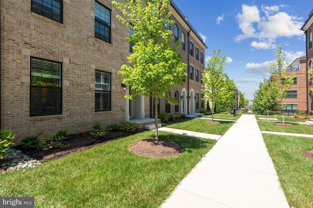 view of property's community featuring a yard