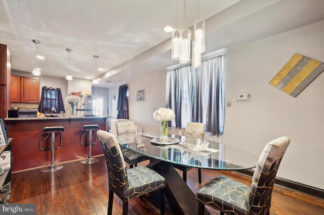 dining room featuring dark hardwood / wood-style flooring