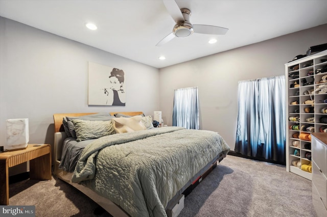 carpeted bedroom with ceiling fan