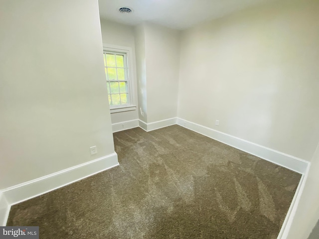 unfurnished room with carpet floors