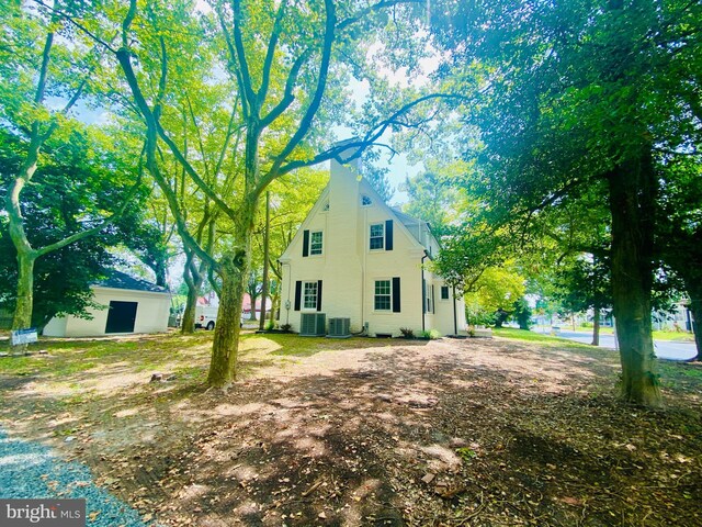 view of side of property with central AC