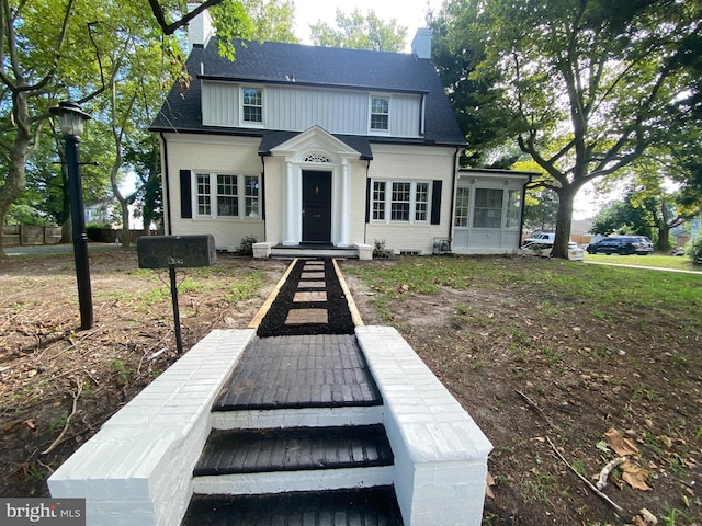 view of front facade with a sunroom