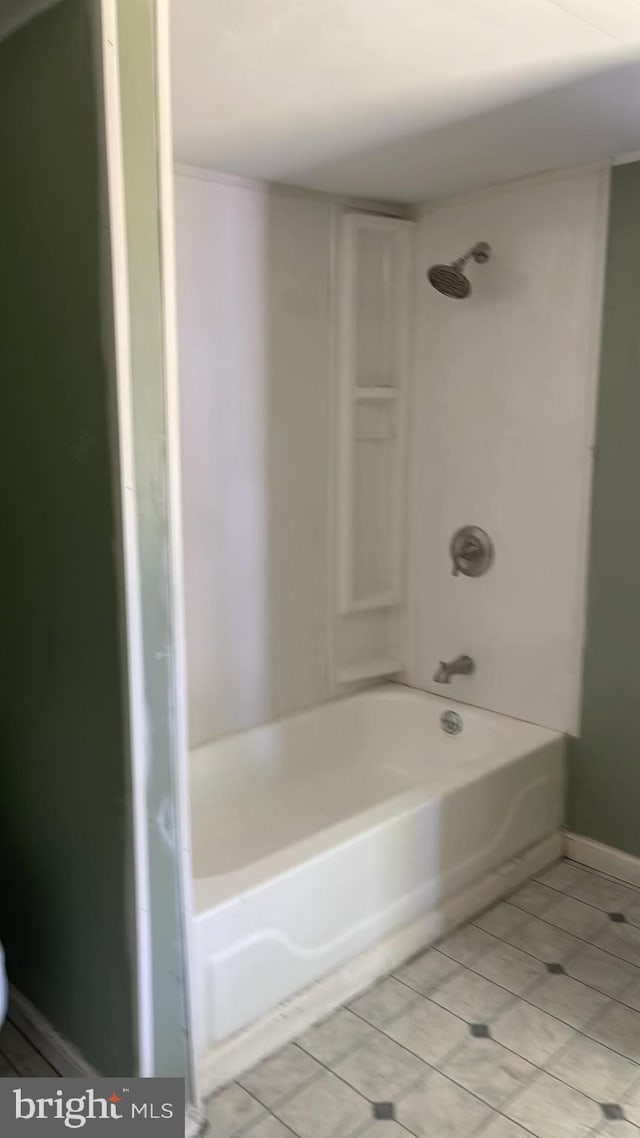 bathroom featuring tile patterned floors and shower / bathtub combination