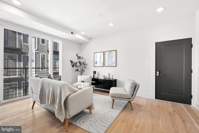 living room with light hardwood / wood-style floors