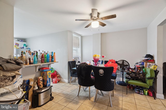 tiled dining room with ceiling fan