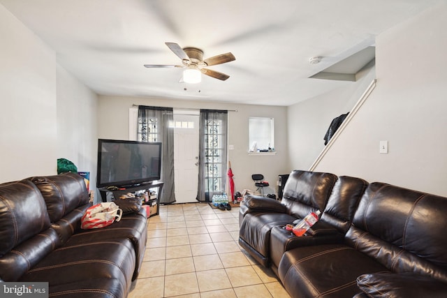 living room with ceiling fan and light tile patterned flooring