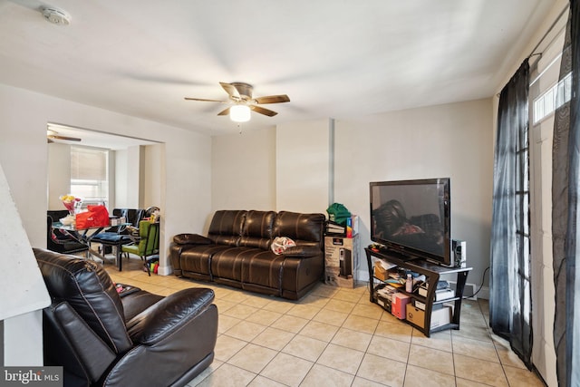 living room with ceiling fan and light tile patterned floors