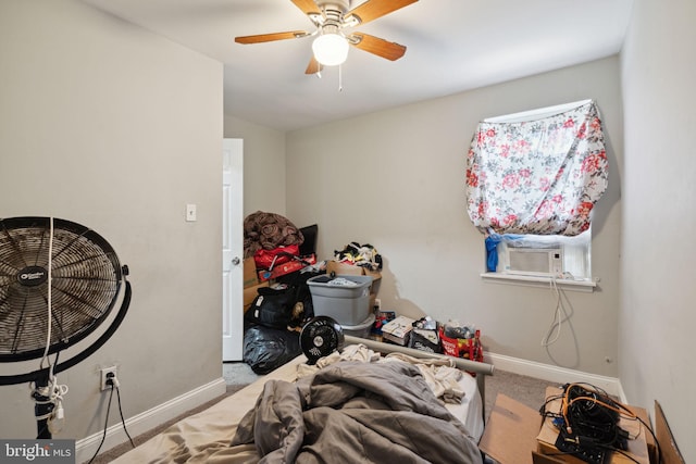 bedroom with light carpet, ceiling fan, and cooling unit