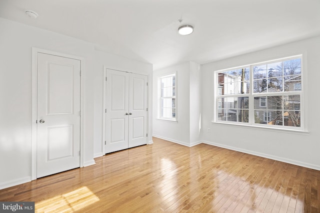 unfurnished bedroom with wood-type flooring