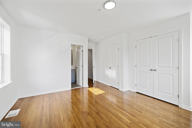 unfurnished bedroom with light hardwood / wood-style floors