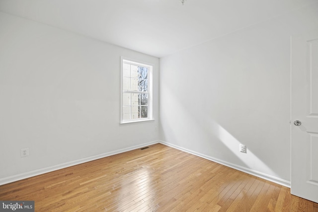 unfurnished room with light hardwood / wood-style flooring