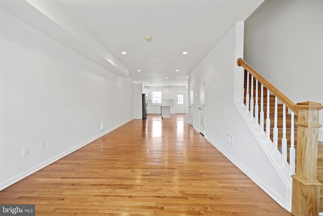 unfurnished living room featuring light hardwood / wood-style floors