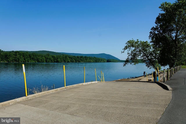 dock area featuring a water and mountain view