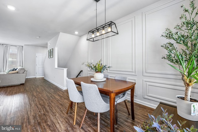 dining room with dark hardwood / wood-style floors