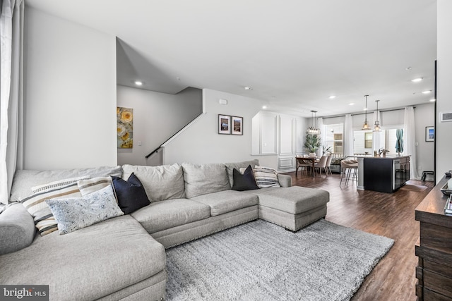 living room featuring dark wood-type flooring