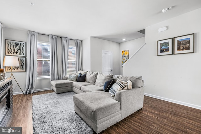 living room featuring dark wood-type flooring