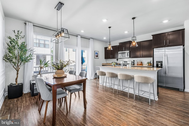 dining area featuring dark hardwood / wood-style flooring