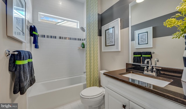 full bathroom featuring tile patterned floors, vanity, shower / bath combination with curtain, and toilet