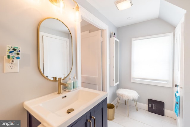 bathroom featuring tile patterned flooring and vanity