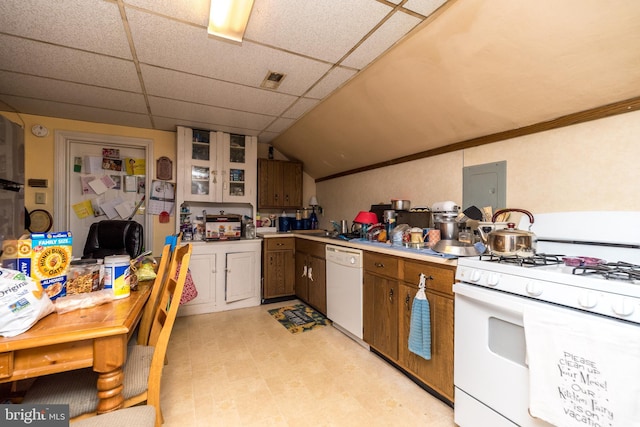 kitchen with a drop ceiling, white appliances, electric panel, sink, and vaulted ceiling