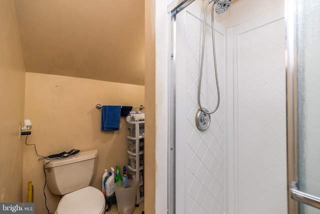 bathroom with toilet and a shower with shower door