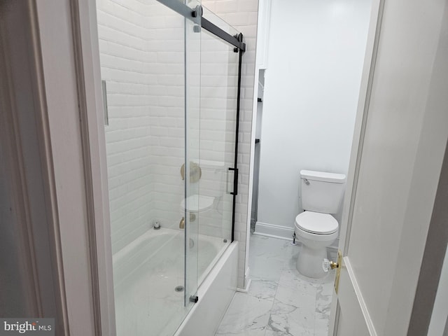 bathroom featuring toilet and enclosed tub / shower combo