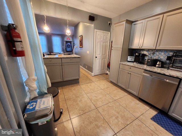 kitchen with dishwasher, pendant lighting, gray cabinets, and light stone counters