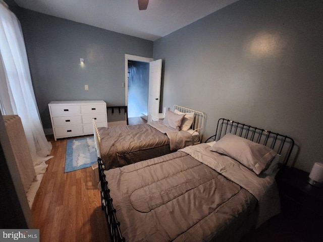 bedroom featuring ceiling fan and light hardwood / wood-style flooring