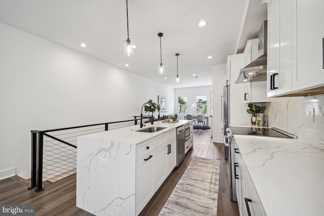 kitchen with white cabinetry, electric stove, sink, dark hardwood / wood-style floors, and a center island with sink