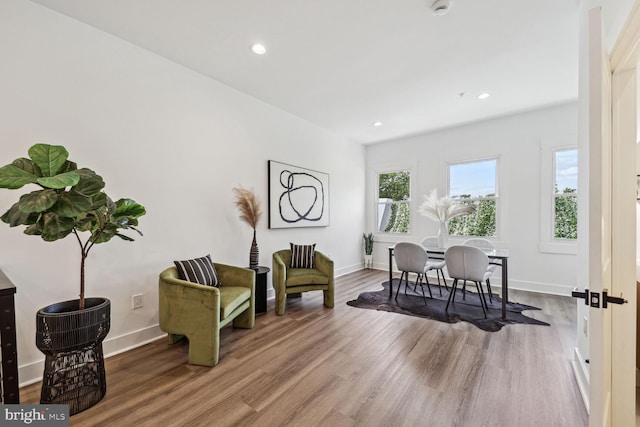 living area with hardwood / wood-style flooring