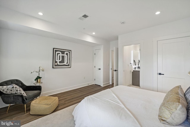 bedroom featuring dark hardwood / wood-style flooring