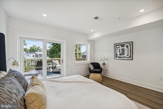 bedroom with hardwood / wood-style flooring and access to exterior