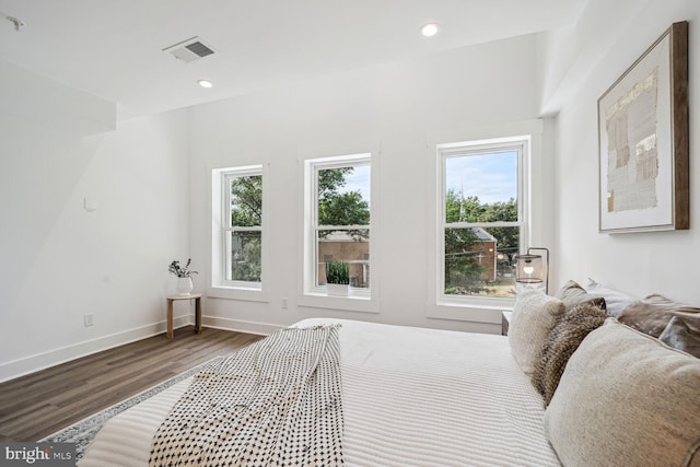 bedroom with hardwood / wood-style floors