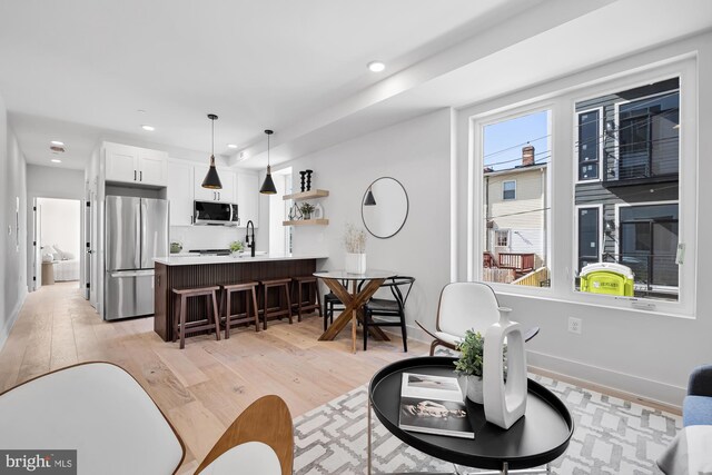 living room with light hardwood / wood-style floors