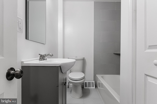 bathroom with tile patterned floors, vanity, and toilet