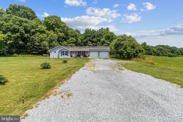 ranch-style home with a garage and a front yard