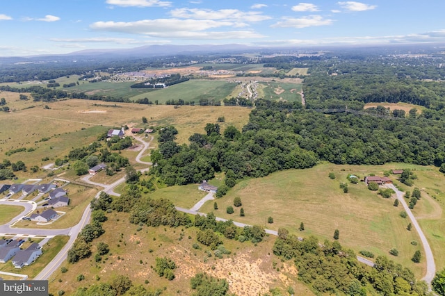 birds eye view of property with a rural view