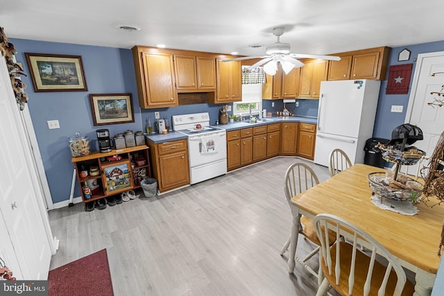 kitchen with ceiling fan, light hardwood / wood-style floors, and white appliances