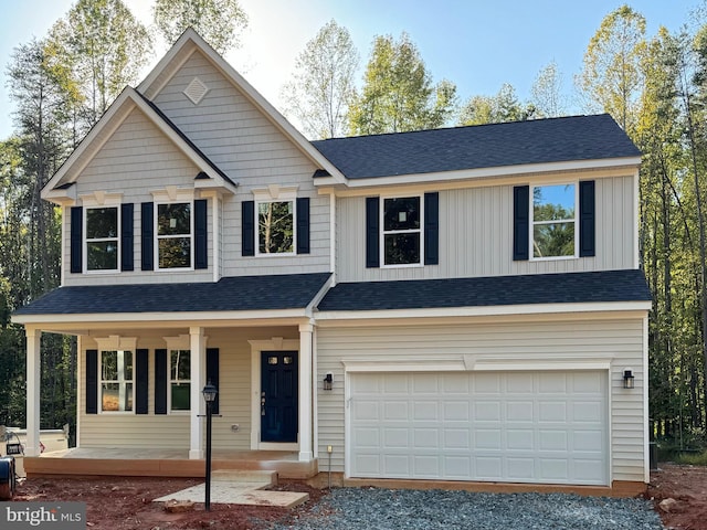 view of front facade featuring covered porch and a garage