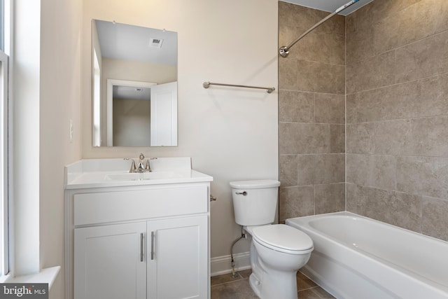 full bathroom with tile patterned flooring, vanity, toilet, and tiled shower / bath