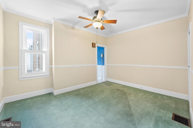 empty room featuring ornamental molding, ceiling fan, and carpet flooring