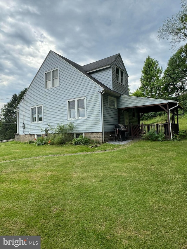 view of side of property with a lawn