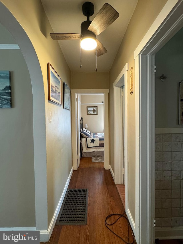 hall with dark hardwood / wood-style floors