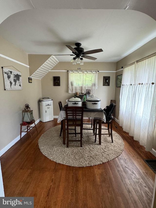 dining area featuring hardwood / wood-style floors and ceiling fan