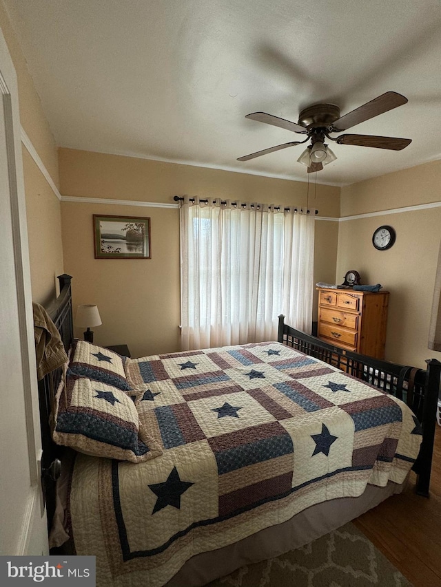 bedroom featuring ceiling fan and wood-type flooring