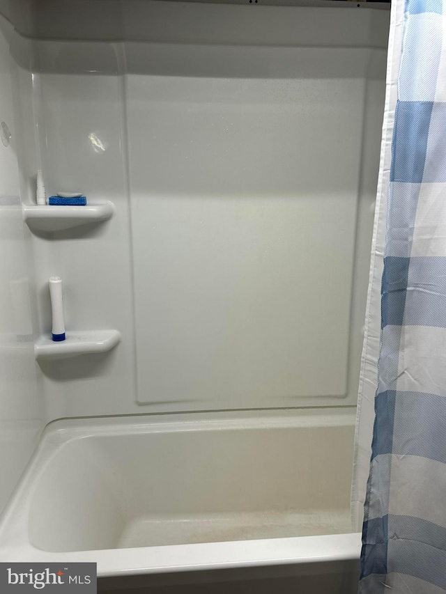 bathroom with a shower with curtain