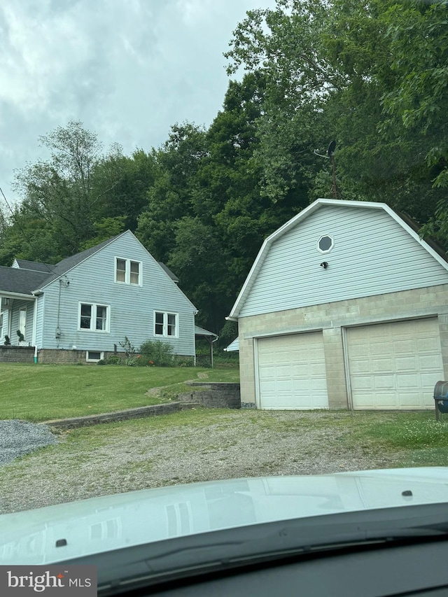 garage featuring a yard