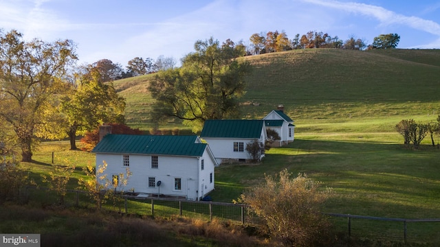 birds eye view of property with a rural view